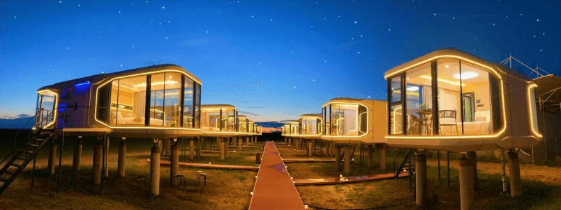 Glamping resort with MIR capsule units set in forest landscape